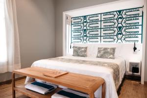 Postel nebo postele na pokoji v ubytování Niu Beach Hôtel Moorea