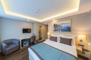 Ένα ή περισσότερα κρεβάτια σε δωμάτιο στο Molton Monapart Mecidiyekoy +55 φωτογραφίες