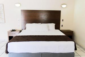 Postel nebo postele na pokoji v ubytování Hotel Sntenario