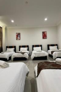 Postel nebo postele na pokoji v ubytování Hotel Mutiara KGMMB, Melaka