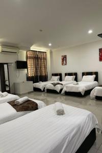 Postel nebo postele na pokoji v ubytování Hotel Mutiara KGMMB, Melaka