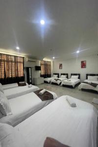 Postel nebo postele na pokoji v ubytování Hotel Mutiara KGMMB, Melaka