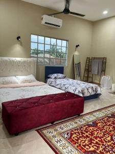 Ένα ή περισσότερα κρεβάτια σε δωμάτιο στο Al-Hijrah Homestay Meru Klang