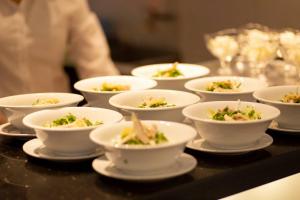 a group of bowls of food on a table at Hoa Hong Hotel - Xa Dan in Hanoi