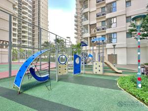 a playground with a slide and a swing at Country Garden Danga Bay Sea View Homestay by Stayrene in Johor Bahru