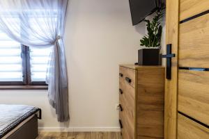 Posteľ alebo postele v izbe v ubytovaní Apartament TatraVika z basenem i widokiem