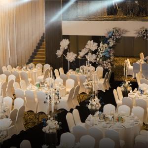 a set up for a wedding banquet with white tables and chairs at La Vela Hue Hotel in Hue +98 photos