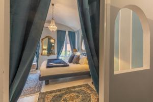 Postel nebo postele na pokoji v ubytování Corte Realdi Suites Piazza Erbe