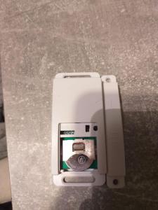a small white camera sitting on a table at Privatzimmer ohne Komfort im historischen Bahnhof Lalendorf in Lalendorf