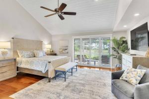 a bedroom with a bed and a ceiling fan at Perfect Match on Baywood Lane in Wesley Chapel