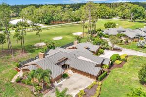 an aerial view of a house with a golf course at Perfect Match on Baywood Lane in Wesley Chapel