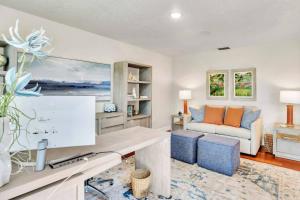 a living room with a desk and a couch at Perfect Match on Baywood Lane in Wesley Chapel