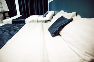 Postel nebo postele na pokoji v ubytování V Hotel Sri Gombak (Previously MyHome Hotel)