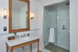 a bathroom with a sink and a glass shower at Principal York in York