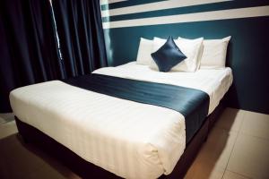 Postel nebo postele na pokoji v ubytování V Hotel Sri Gombak (Previously MyHome Hotel)