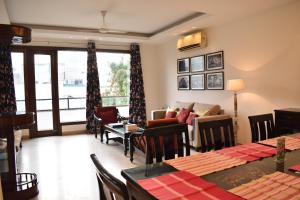 a living room with a couch and a table at Two Green Park in New Delhi