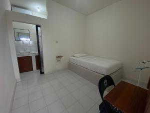 Postel nebo postele na pokoji v ubytování Ayodhya Guesthouse