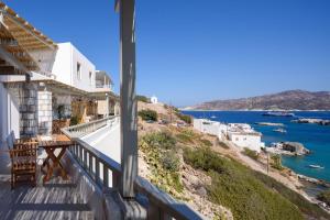 a balcony of a house with a view of the ocean at ASTRAVI in Kimolos