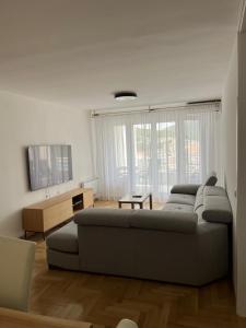 a living room with a couch and a table at Apartment Darna in Neum