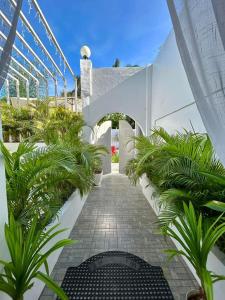 a walkway with plants in a building at Scenery Resort & Spa in Tagaytay