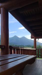 a wooden porch with a view of a mountain at Chatka u Bratka - Chalet, Stunning Mountain Views in Ždiar