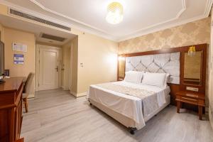 Postel nebo postele na pokoji v ubytování Myy Boutique Hotel
