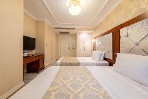 Postel nebo postele na pokoji v ubytování Myy Boutique Hotel