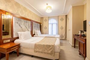 Postel nebo postele na pokoji v ubytování Myy Boutique Hotel + 30 fotografií