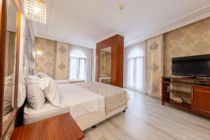 Postel nebo postele na pokoji v ubytování Myy Boutique Hotel