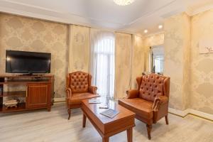 TV a/nebo společenská místnost v ubytování Myy Boutique Hotel