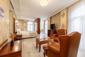 TV a/nebo společenská místnost v ubytování Myy Boutique Hotel