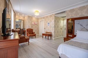 TV a/nebo společenská místnost v ubytování Myy Boutique Hotel