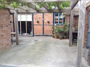 A porch or other outdoor area at Unique Barn in The Vale of Evesham 
