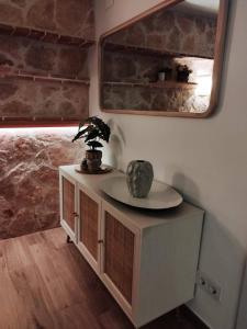 a room with a table and a mirror on a wall at Nuevo Apartamento Moderno en Benicasim con Terraza y a Minutos de la Playa in Benicàssim +20 photos