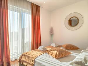 Ένα ή περισσότερα κρεβάτια σε δωμάτιο στο Kaša Rooms 2