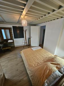 a bedroom with a bed and a flat screen tv at Danai Traditional Apartment in Samos