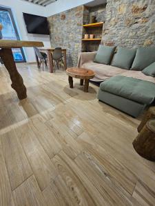 a living room with a couch and a table at Danai Traditional Apartment in Samos