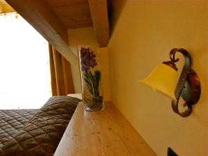 A bed or beds in a room at Bellaguarda ROOMS 10min da Tirano