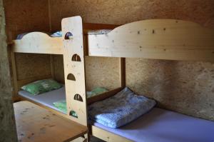 a couple of bunk beds in a room at Gästedorf Waldheimat in Langenwang