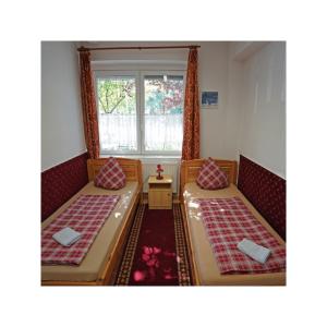 Letto o letti in una camera di Balaton Vendégház Fonyód