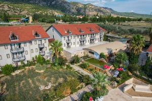 an aerial view of a building with palm trees at Halıcı Hotel Resort & SPA in Pamukkale