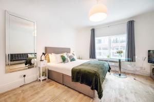 Ένα ή περισσότερα κρεβάτια σε δωμάτιο στο Welcome London - Short's Gardens