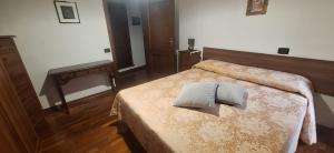 Postel nebo postele na pokoji v ubytování Casa Ausonia