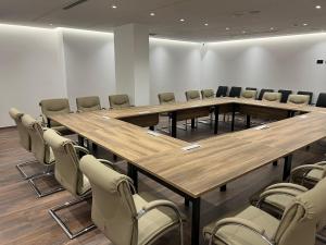 a conference room with wooden tables and chairs at Black Diamond Hotel Dhermi in Dhërmi +37 photos