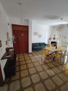 a living room with a table and a couch at Casa Vinella in Putignano