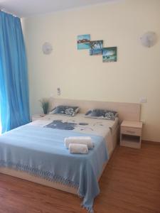 Postel nebo postele na pokoji v ubytování APARTAMENT APOLONIA 3 CAMERE CU VEDERE LA MARE a40