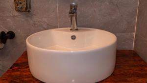 a white sink sitting on top of a counter at A Villa Sunshine house Zanzibar in Jambiani