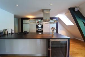 Kuchyň nebo kuchyňský kout v ubytování L'Attik superbe appartement pour 5 personnes