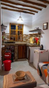 a kitchen with a table and a counter top at A Villa Sunshine house Zanzibar in Jambiani +48 photos