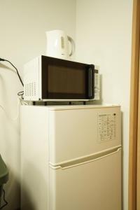 Kuchyň nebo kuchyňský kout v ubytování Guest House 伏見稲荷
